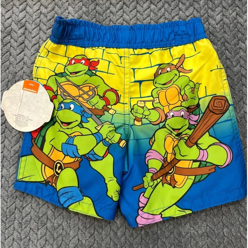 TMNT Shell Up Boys Blue Yellow Nickelodeon Swim Trunks Graphic Mesh Lined 12M